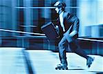Businessman In-Line Skating Carrying Briefcase