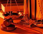 Gavel and Balance Scale with Books in Background