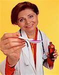 Portrait of Nurse Holding Spoon Of Medicine