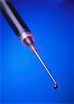 Close Up of Syringe with Drop of Blood