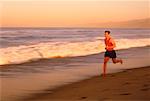 Man Running in Surf on Beach