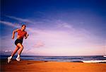 Woman Running on Beach