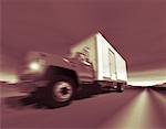 Blurred View of Transport Truck On Highway