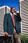 Businessman Using Cell Phone Outdoors