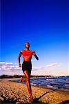 Woman Running on Beach