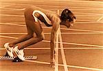 Female Runner on Starting Blocks