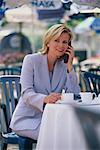 Business Woman Using Cell Phone At Outdoor Cafe