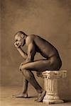 Nude Man Seated on Pedestal