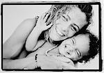 Portrait of Mother and Daughter Embracing, Laughing