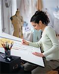 Woman Sketching at Drafting Table