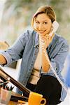 Portrait of Woman Using Phone at Desk