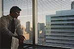 Businessman Looking Out of Window