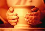 Close-Up of Potter's Hands on Clay