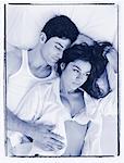 Overhead View of Couple Lying on Bed