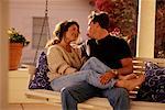 Couple Sitting on Porch Swing