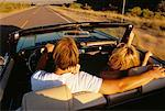 Back View of Couple in Convertible