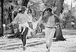 Family Running Through Woods