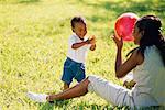 Child Throwing Ball to Mother