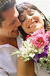 Couple with Bouquet of Flowers