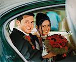 Portrait of Couple in Formal Wear Sitting in Car