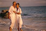 Mature Couple Walking on Beach