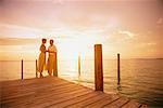 Mature Couple on Dock at Sunset