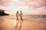 Couple Walking on Beach, Holding Hands
