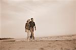 Mature Couple Walking on Beach