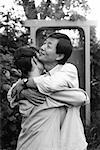 Mature Couple Embracing in Garden