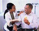 Female Doctor and Mature Male Patient Talking