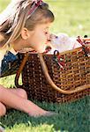 Girl with Puppy in Picnic Basket