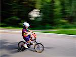Blurred View of Boy on Bike