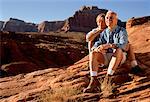 Mature Couple Sitting Outdoors Lake Powell, Arizona, USA