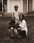 Portrait of Family in Front of House