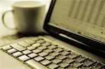 Close-Up of Laptop Computer and Coffee Cup