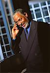 Portrait of Mature Businessman Using Cell Phone