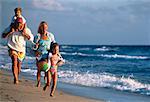 Family Running on Beach