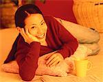 Portrait of Woman with Newspaper And Mug, Resting Head on Hand