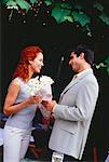 Man Giving Flowers to Woman Outdoors