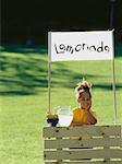 Girl with Lemonade Stand in Field