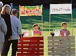 Boy and Girl with Competing Lemonade Stands