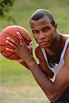 Portrait of Man Holding Basketball Outdoors