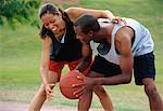 Couple Playing Basketball Outdoors