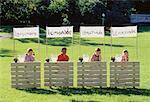 Children with Competing Lemonade Stands, Waiting for Customers