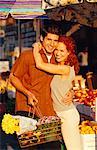 Portrait of Couple Embracing at Fruit Market