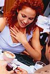 Man Giving Ring to Woman at Outdoor Cafe