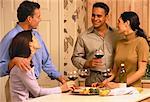 Couples Drinking Wine in Kitchen