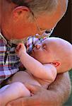 Close-Up of Grandfather Holding Baby