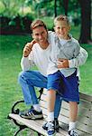 Portrait of Father and Son on Park Bench