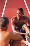 Men Sitting on Race Track